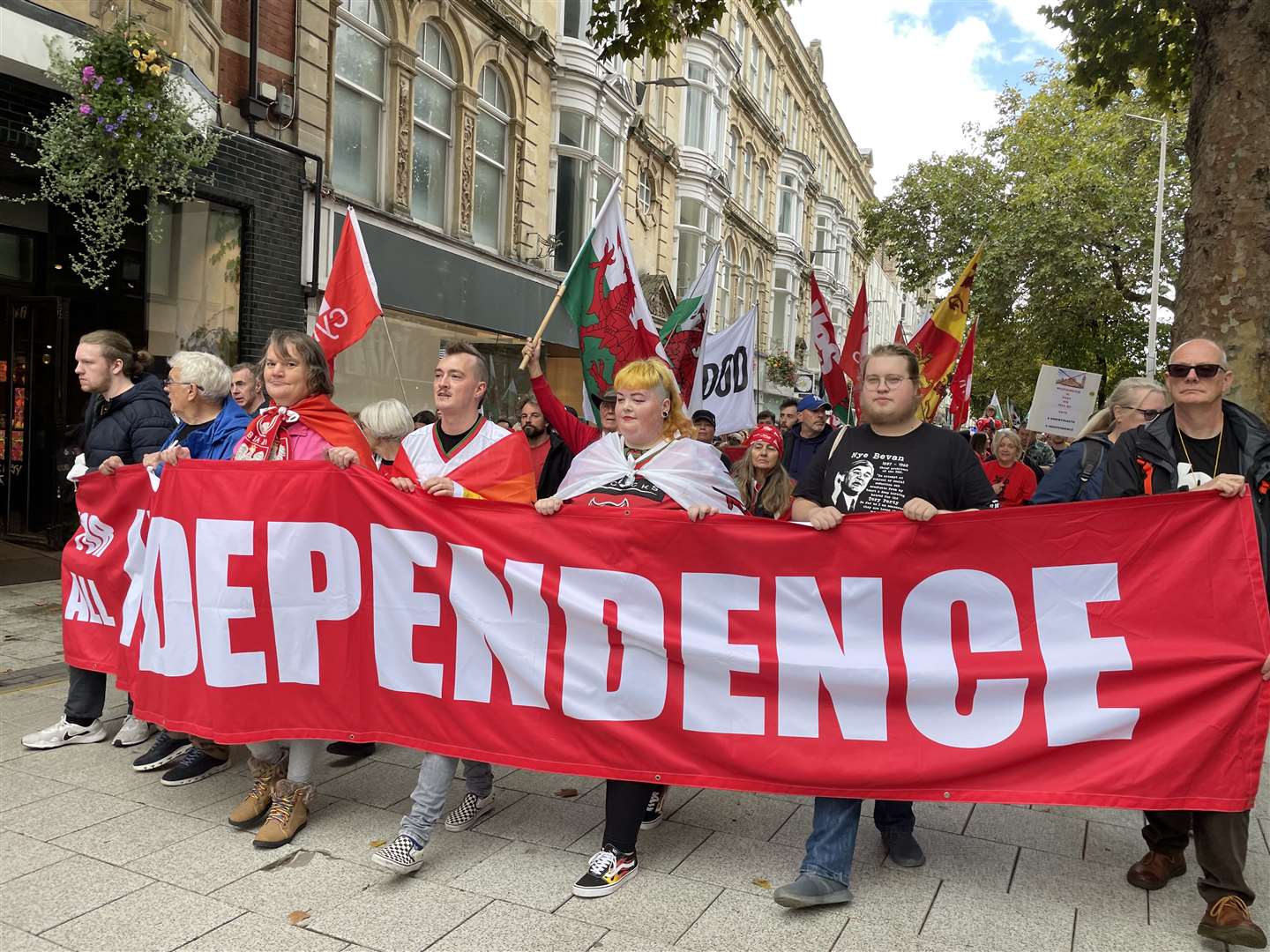 People carry a large independence banner (Bronwen Weatherby/PA)