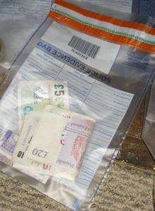 Cash seized in dawn raids