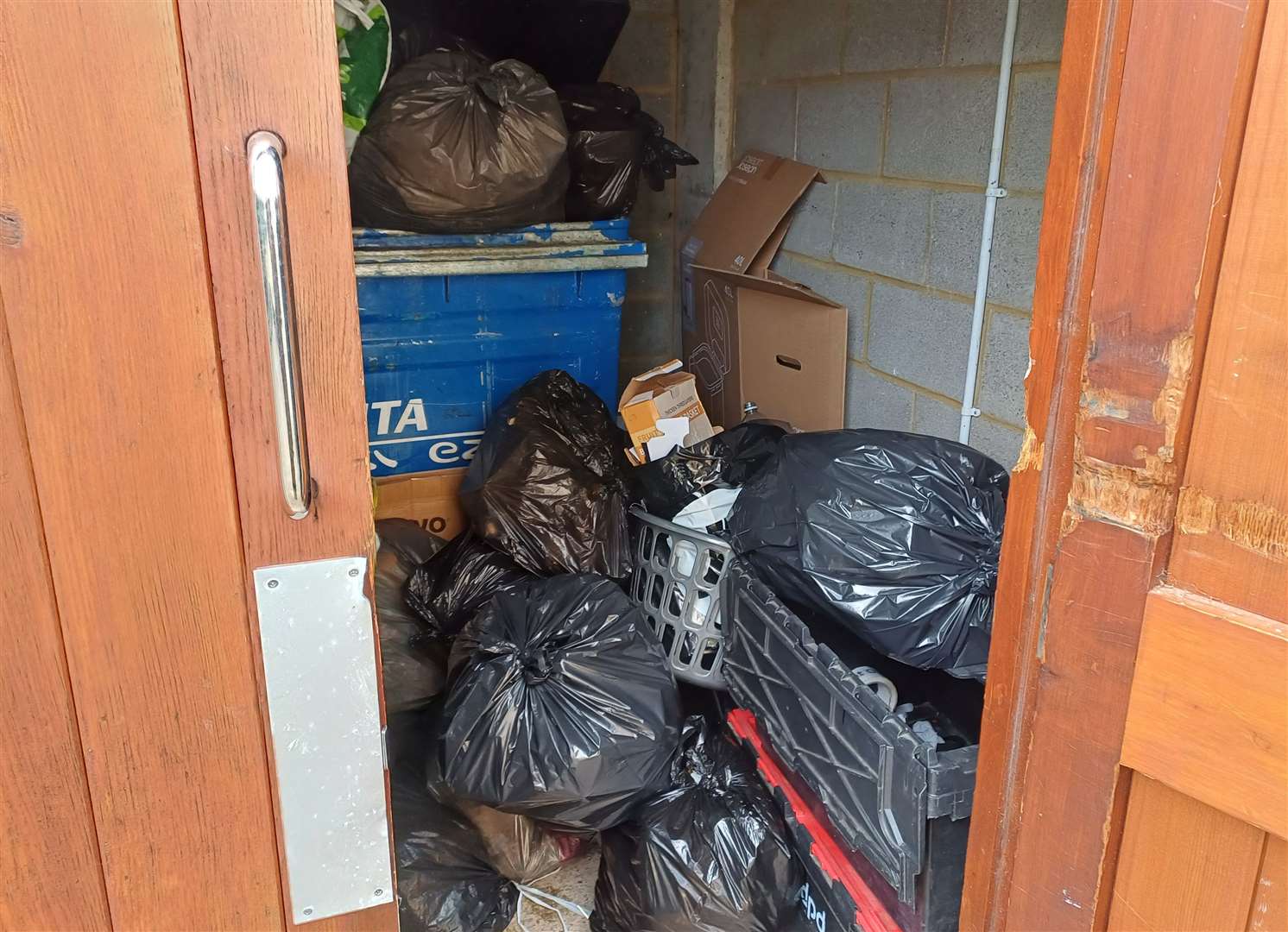 Overflowing communal bins in Clifford Way, Maidstone