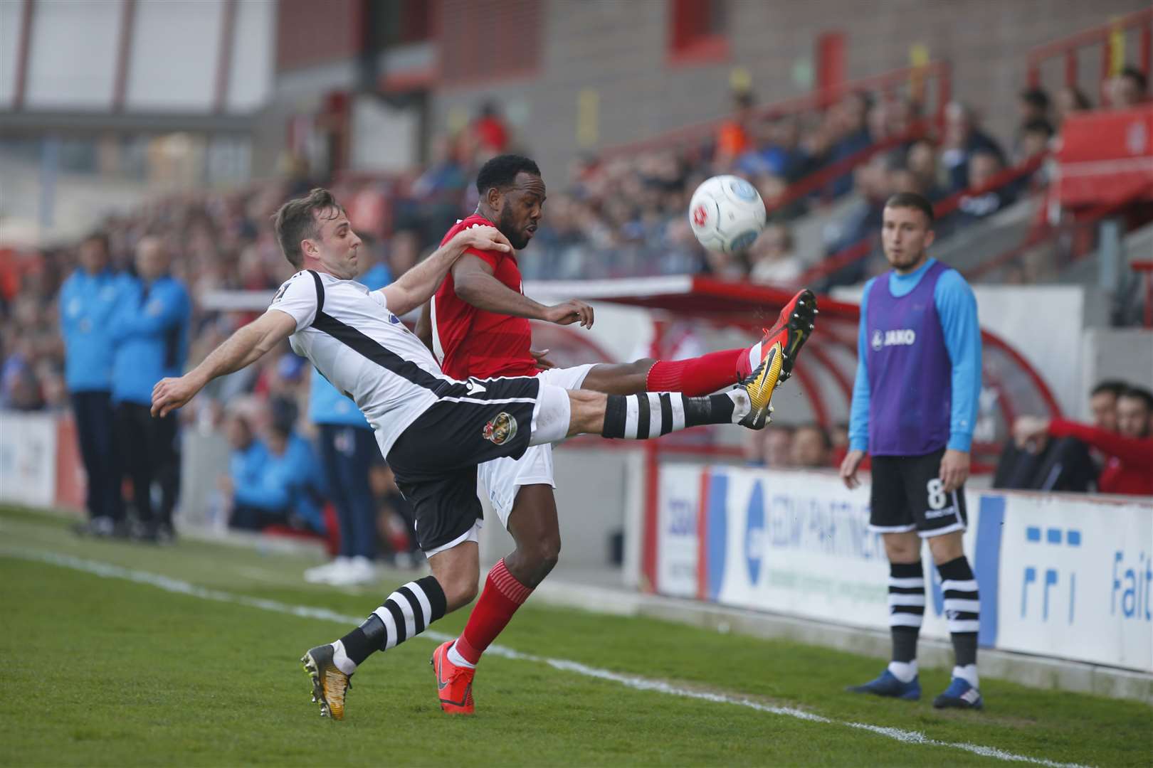 Myles Weston stretches to keep the ball in play Picture: Andy Jones