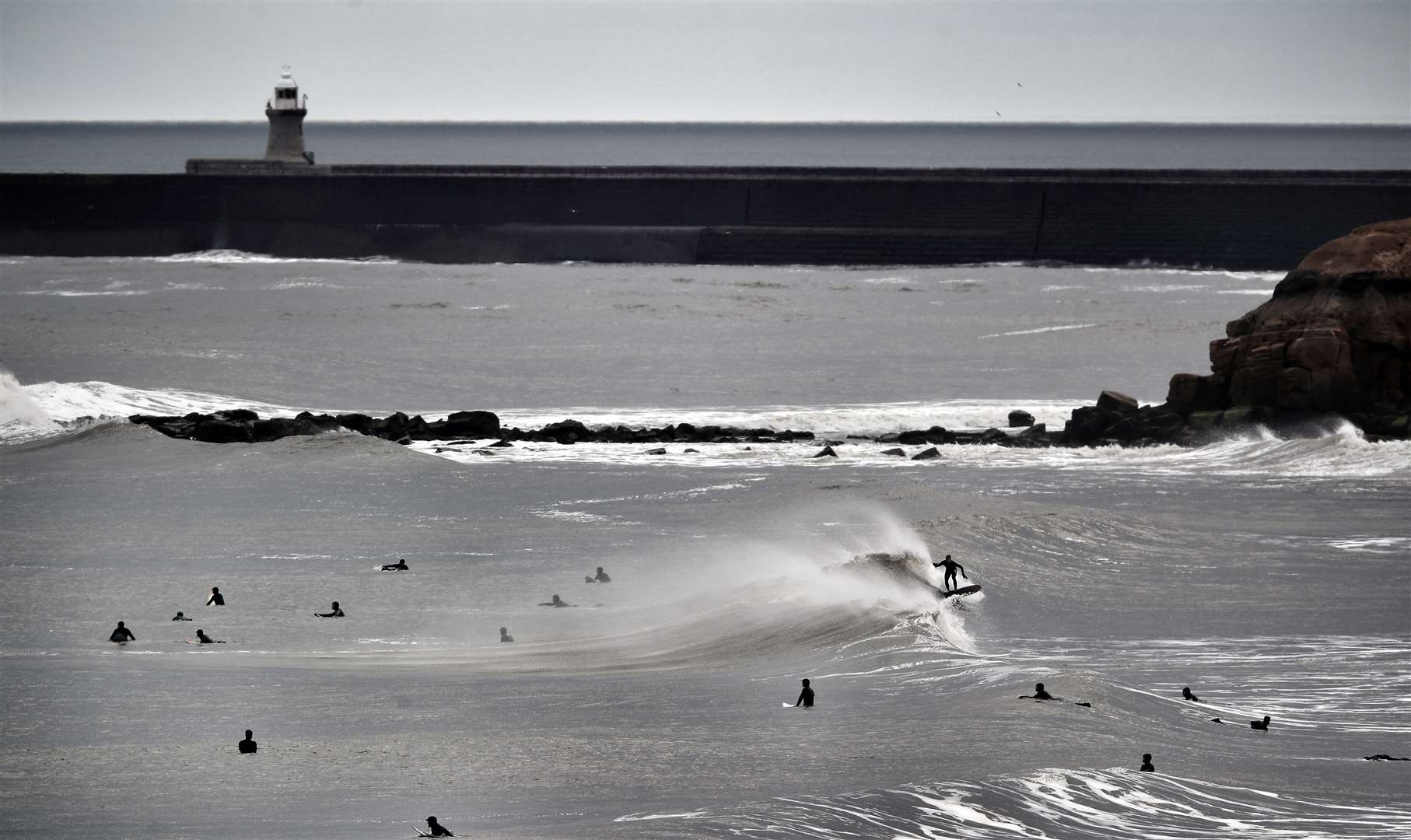Large numbers of surfers were spotted on the beach at Tynemouth despite the lockdown (Owen Humphreys/PA)