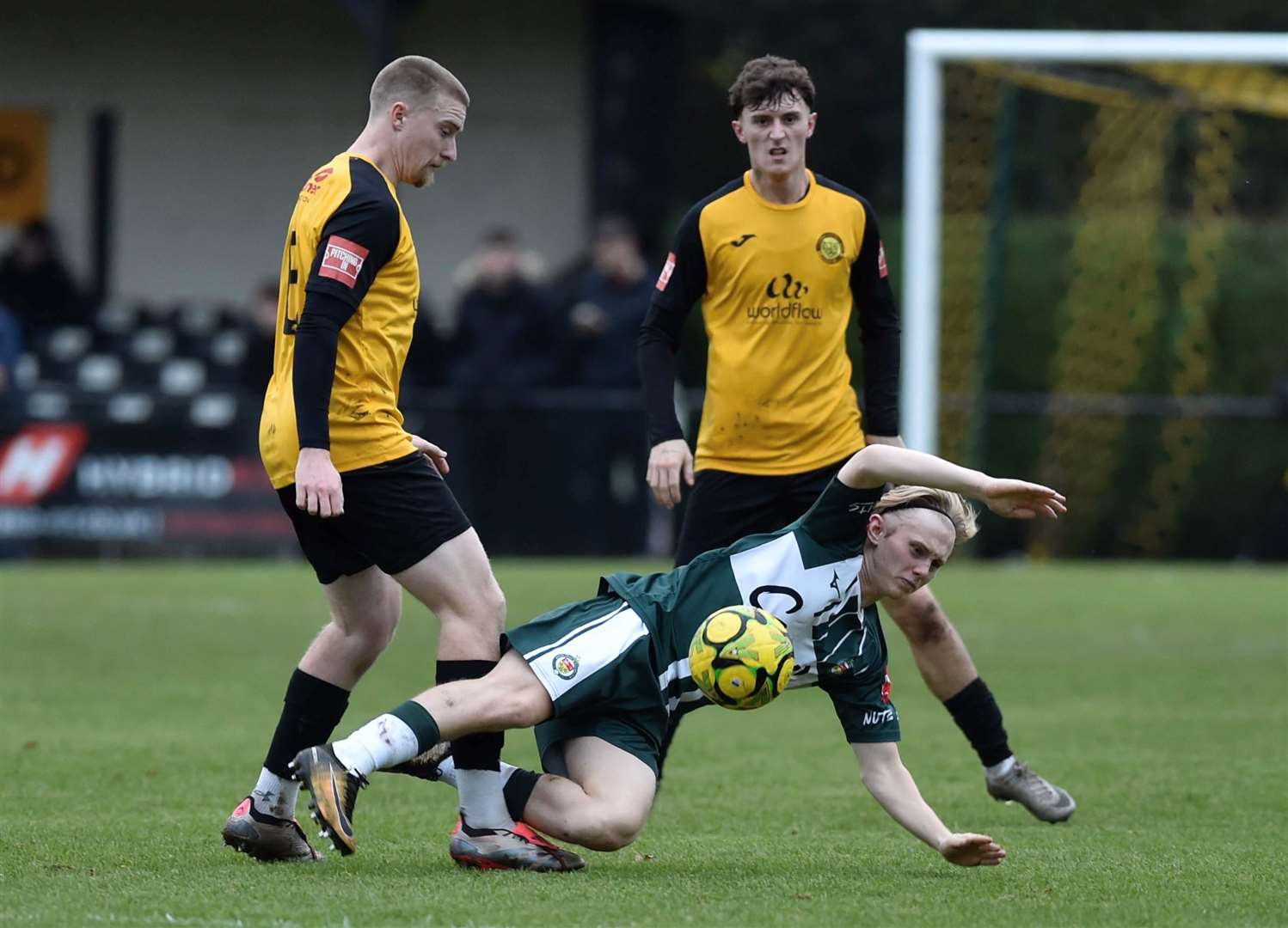 Ashford midfielder Mikey Berry hits the deck at Merstham. Picture: Ian Scammell