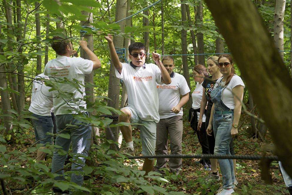 The park runs team-building courses, here a mixed group of mostly Russian oil traders start work on a rope bridge.