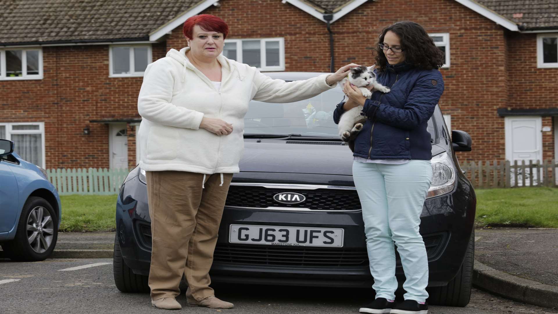 From left, Jane Butcher and Filipa Cunha with Timmy the 3-year-old Portuguese tom cat