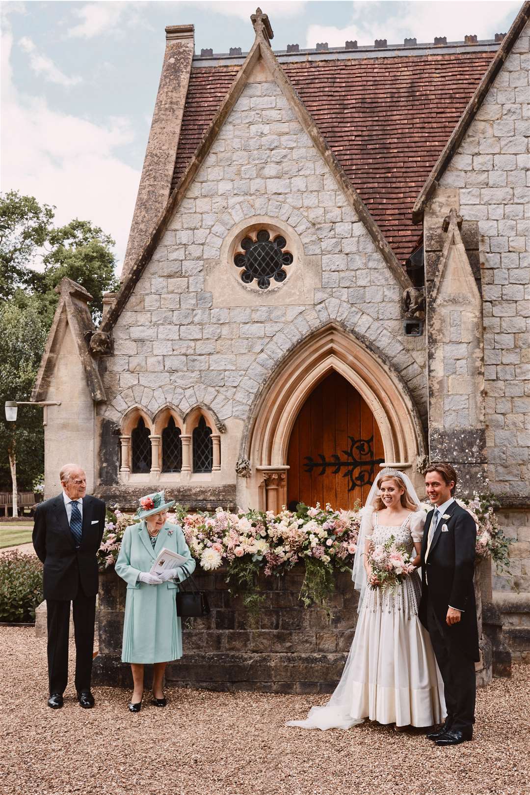 The Queen and the Duke of Edinburgh with the newlyweds (Benjamin Wheeler/PA)