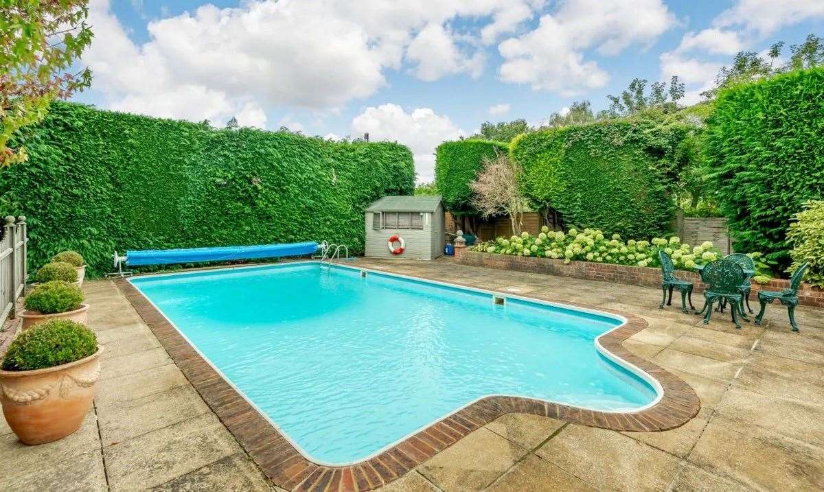 Throw a pool party this summer with your very own outdoor swimming pool. Picture: Strutt & Parker