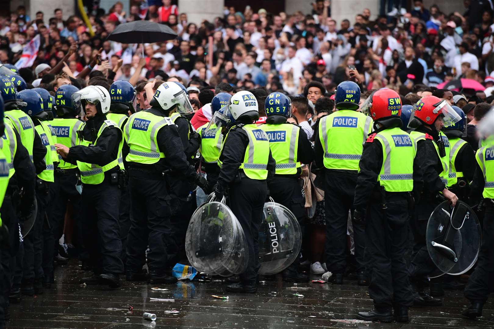 Police watch fans in Trafalgar Square (Ian West/PA)