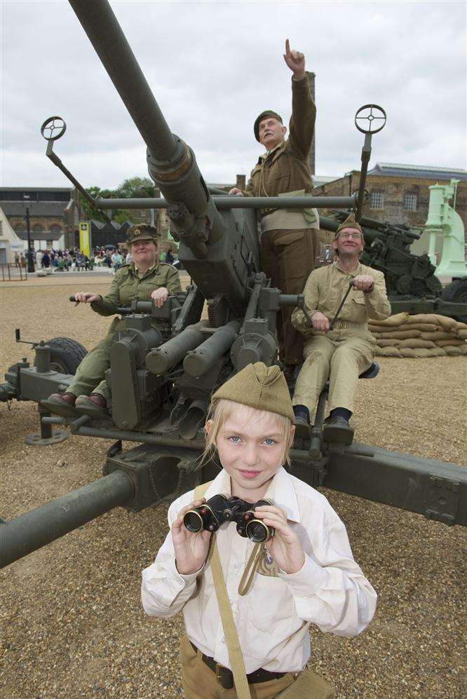 From left, Elaine Mortimore, Rhiannon Mortimore, 8, Andrew Morgan and Wayne Sleck manning a Bofors gun.