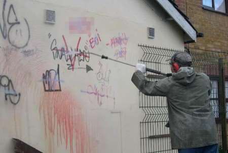 Grafitti being removed in Gillingham's Balmoral Road. Picture courtesy MEDWAY POLICE