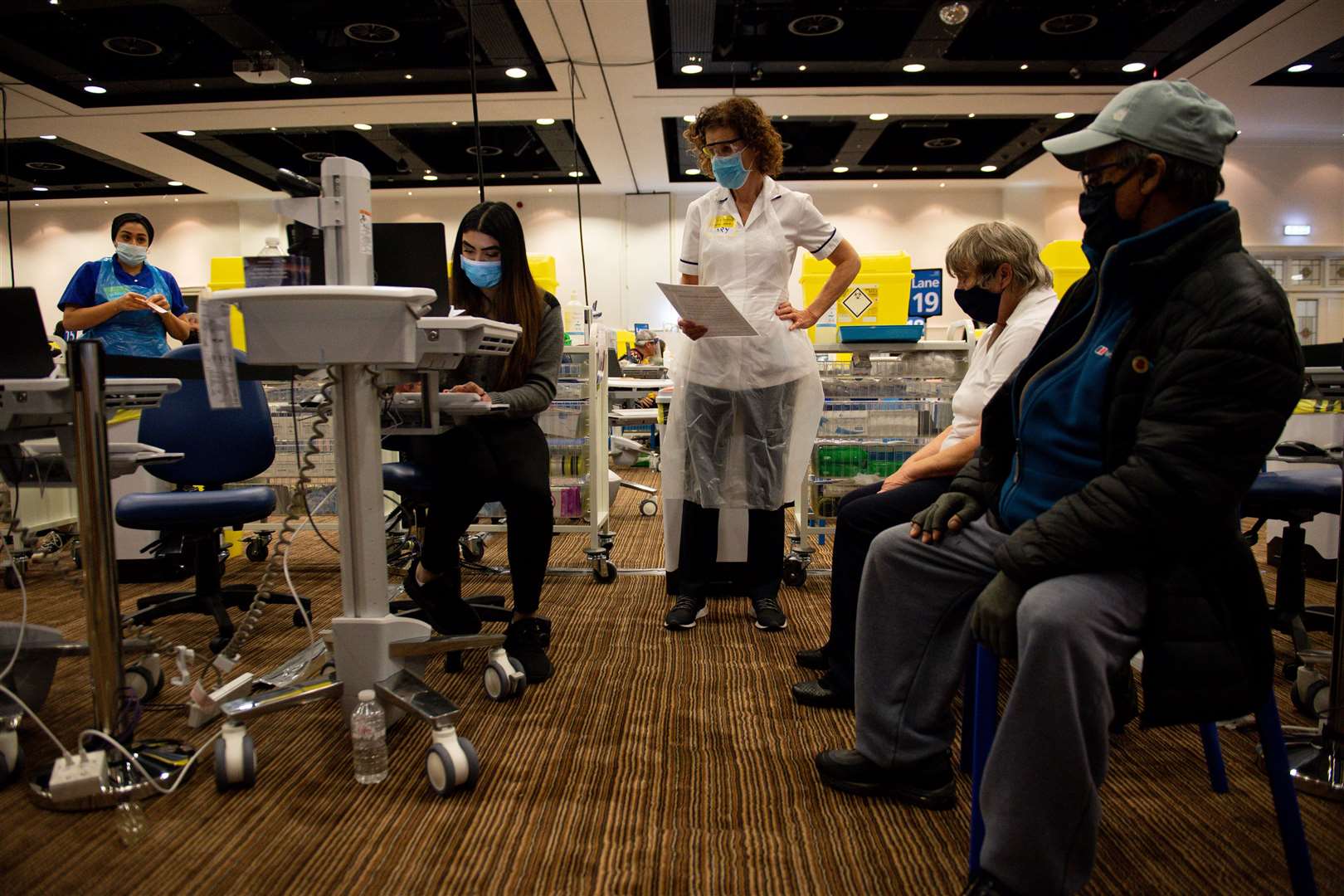 Margaret Miah, 73, receives a Covid-19 vaccination at Villa Park in Birmingham (Jacob King/PA)