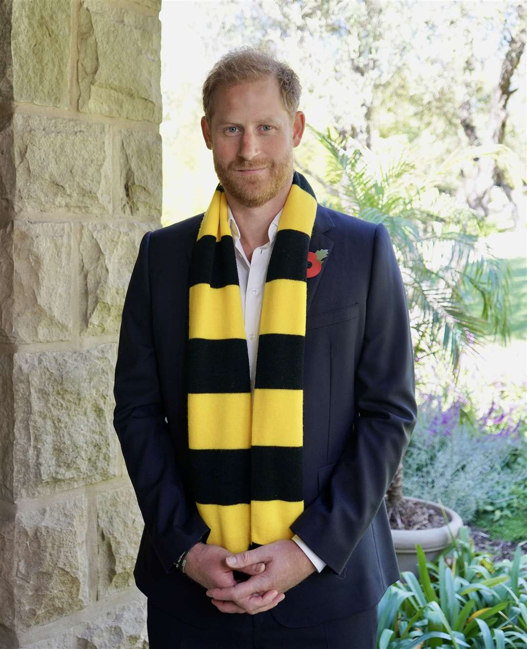 The Duke of Sussex wearing a Scotty’s Little Soldiers scarf (Archewell/PA)