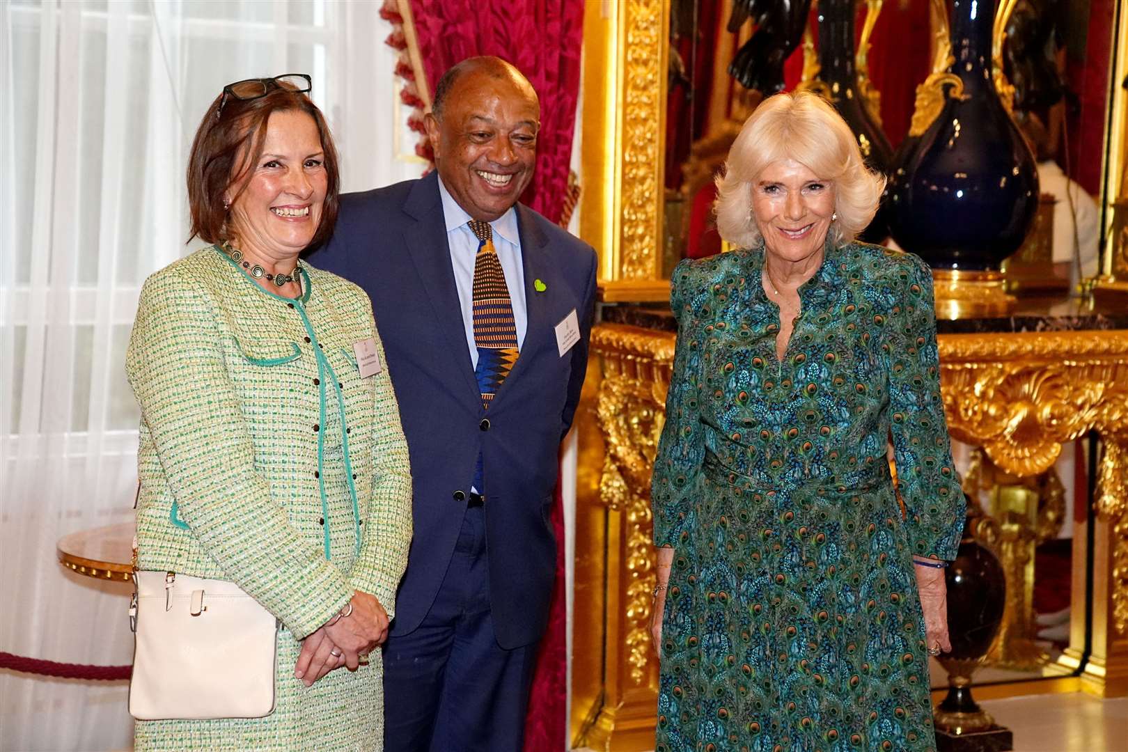 The Queen, patron of Book Aid International, stands with the charity’s vice patron Lord Boateng and chief executive Alison Tweed during the charity’s 70th anniversary reception at St James’s Palace (Aaron Chown/PA)