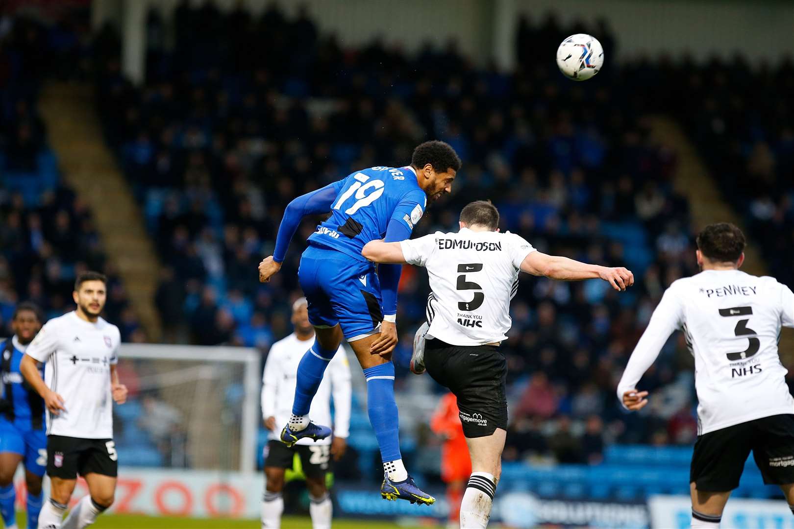 Gillingham forward Vadaine Oliver challenges in the air Picture: Andy Jones