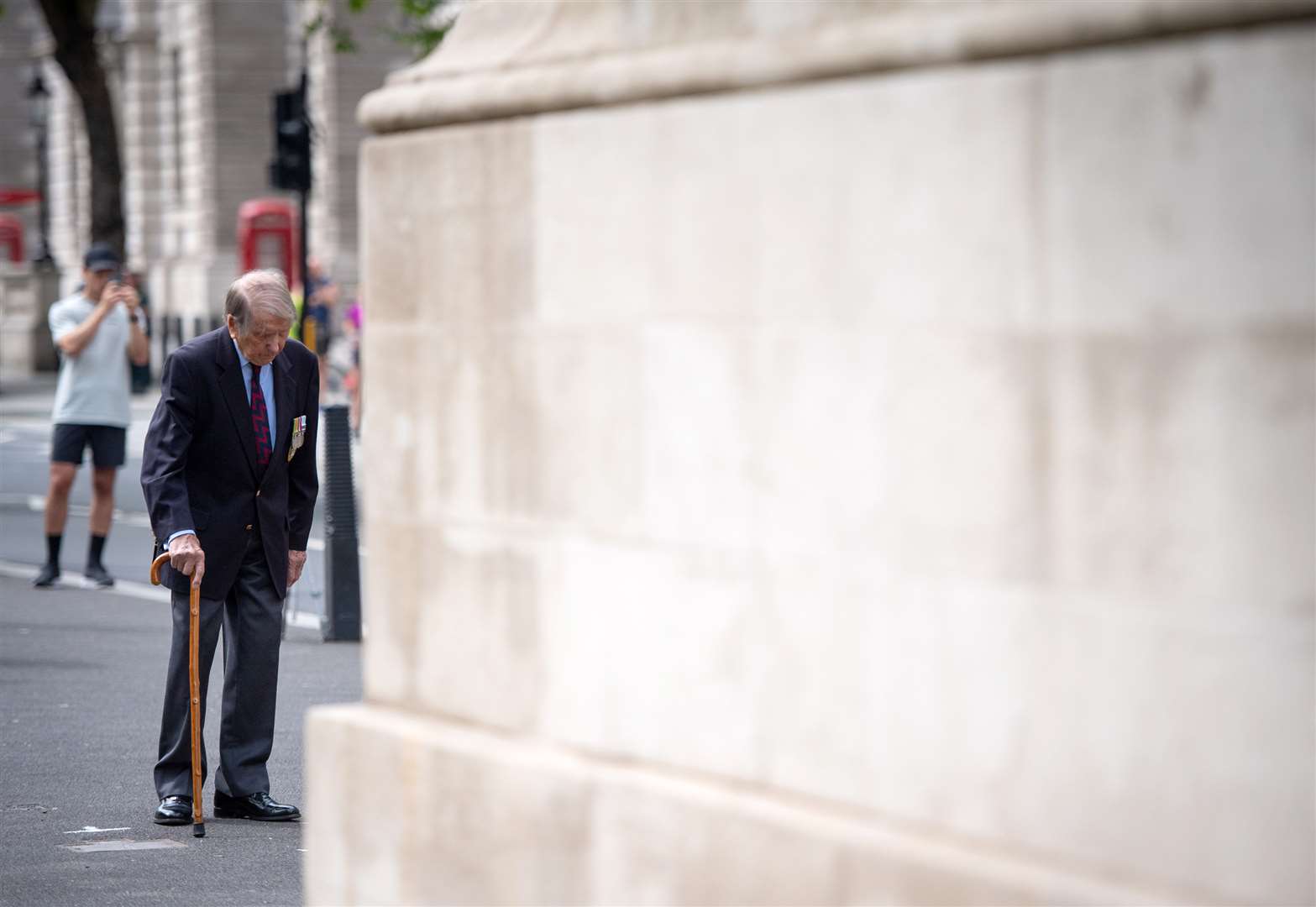 Lou Myers, 92, observes two minutes’ silence at the Cenotaph, in Whitehall (PA)