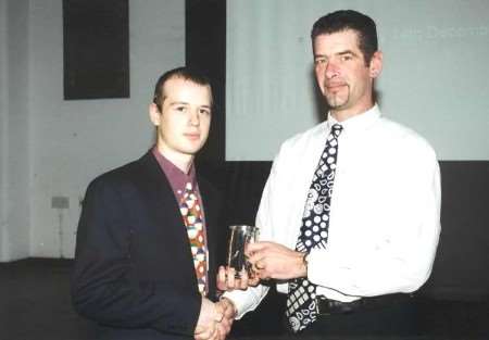 Richard Casson , left, pictured after winning an award for being the top Army trainee