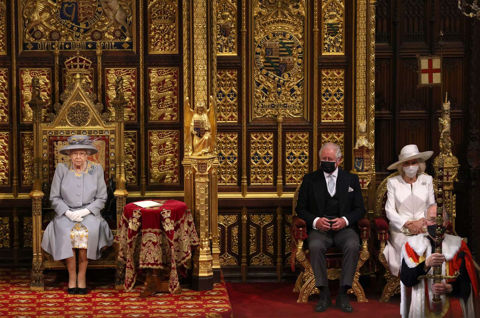 The Prince of Wales and the Duchess of Cornwall seated alongside the Queen in the House of Lords (Chris Jackson/PA)