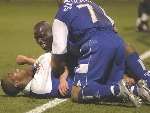 DELIGHT: Matt Jarvis is mobbed by team-mates after scoring Gillingham's second goal. Picture: GRANT FALVEY