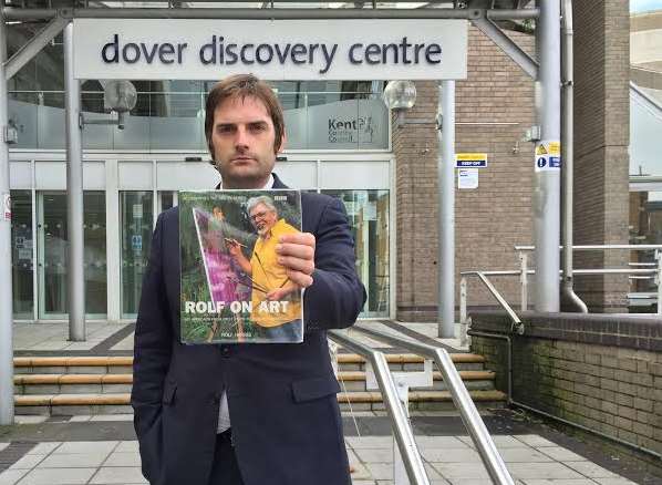 Councillor Peter Wallace with one of the offending books. Picture: Ben Grant