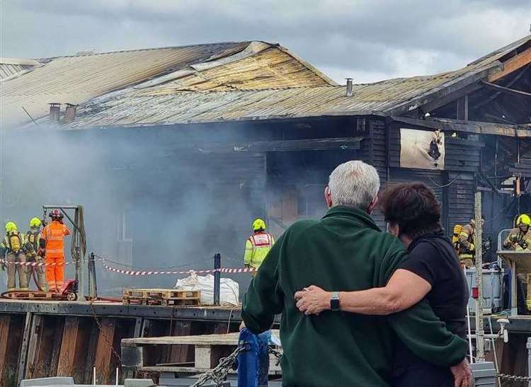 Peter and Elizabeth Bennett watched the fire at the cockle shed in Whitstable Harbour engulfed their business. Picture: Charlotte Rose Nash