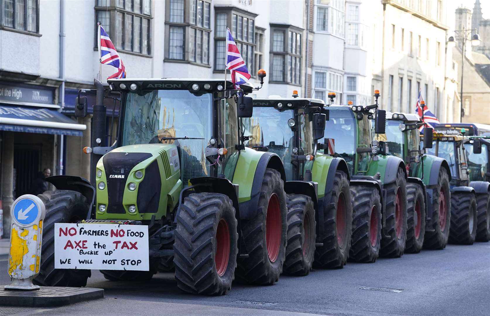 Farmers protest over the changes to inheritance tax rules outside the Oxford Farming Conference (Andrew Matthews/PA)