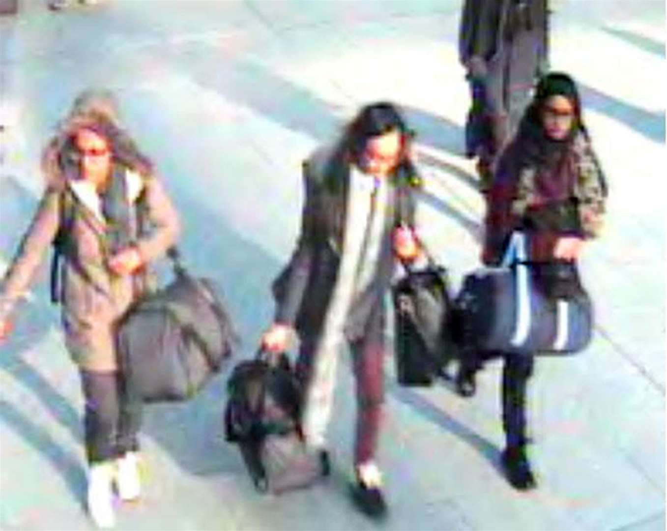 L to R, then 15-year-old Amira Abase, Kadiza Sultana, then 16, and Shamima Begum, then 15, at Gatwick Airport in February 2015 (Metropolitan Police/PA)