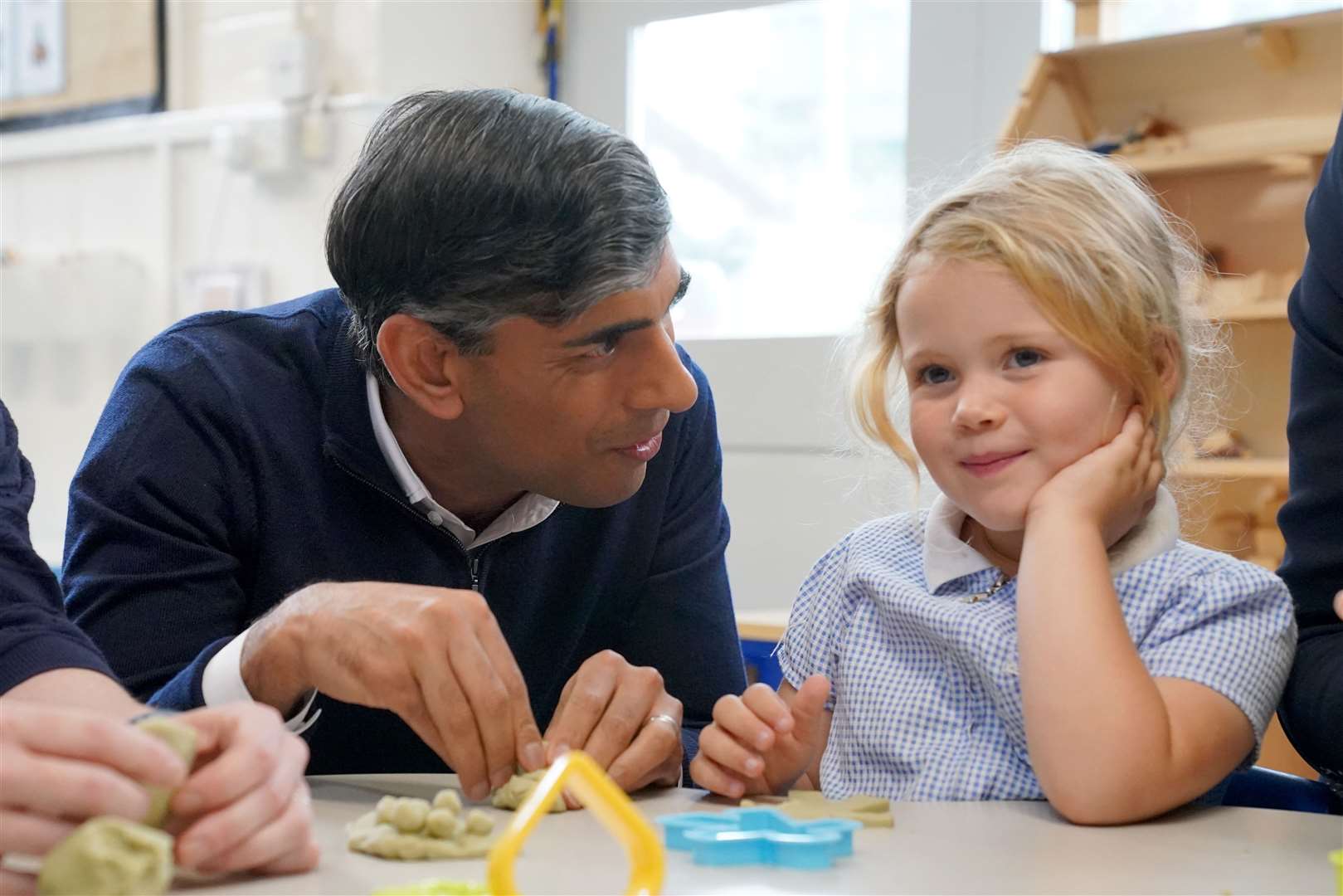 Prime Minister Rishi Sunak chatting to a pupil at Braishfield Primary School in Romsey, Hampshire (Jonathan Brady/PA)