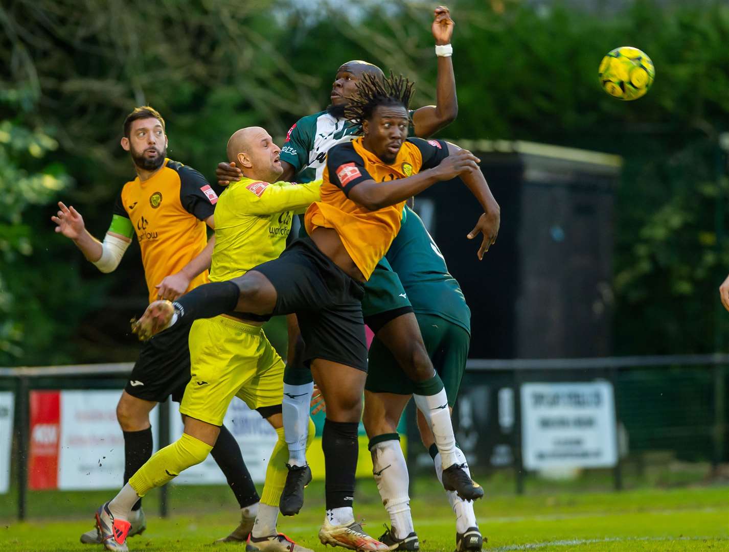 Tolu Jonah jumps for a header during Ashford’s 2-0 defeat at Merstham on Saturday. Picture: Ian Scammell