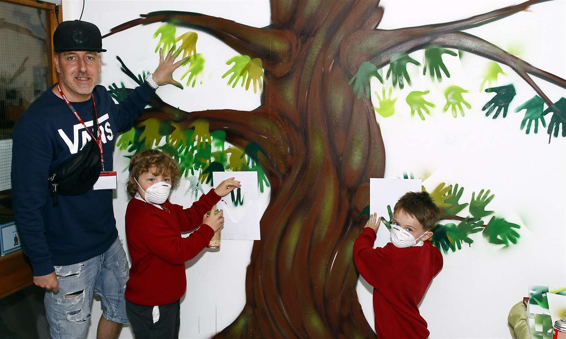 Daniel 8 (left) and Harry 8 (right) practise their skills at Loose Primary School with Graffiti Kings artist Graham Golden. Picture: Sean Aidan 10538106