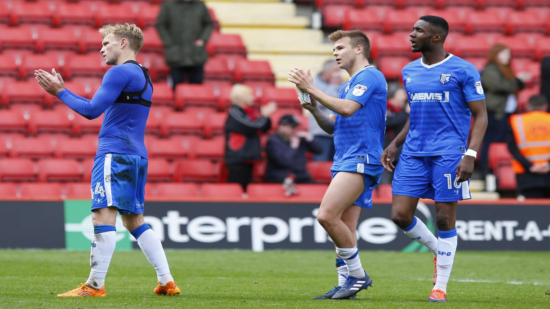Josh Wright, Jake Hessenthaler and Emmanuel Osadebe thanks the Gills faithful for their support at the final whistle Picture: Andy Jones