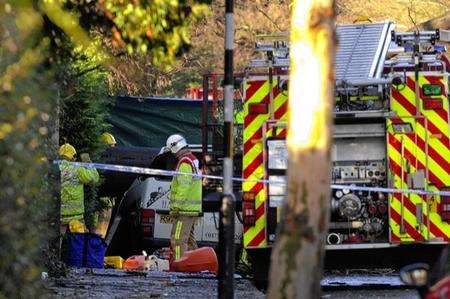 Emergency services with the crushed van