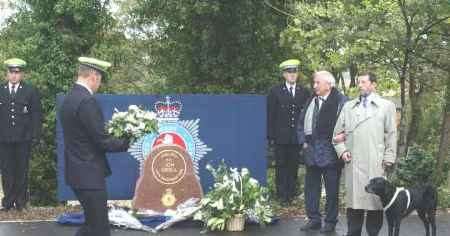 MOVING CEREMONY: Home Secretary David Blunkett and Michael Winner look on as a wreath is laid at the memorial on behalf of Kent Police. Picture: MIKE WATERMAN