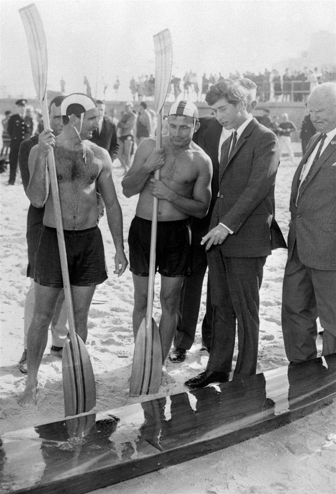 A young Charles looks at a canoe on the beach in Sydney in 1966 (PA)