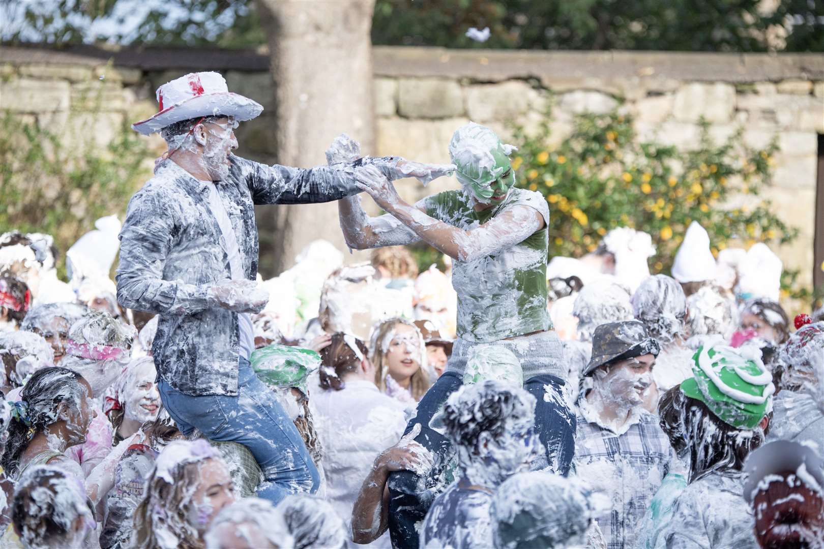 Students take part in the traditional Raisin Monday foam fight on St Salvator’s Lower College Lawn at the University of St Andrews in Fife in October (Lesley Martin/PA)