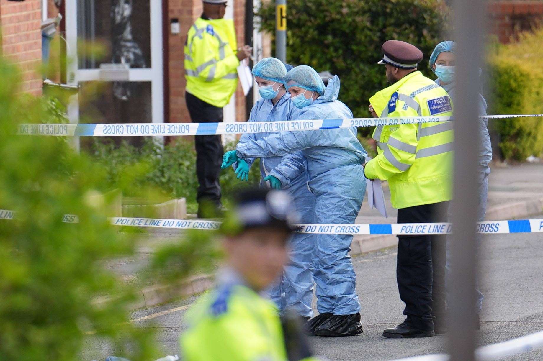 Forensic investigators in Laing Close in Hainault (Jordan Pettitt/PA)