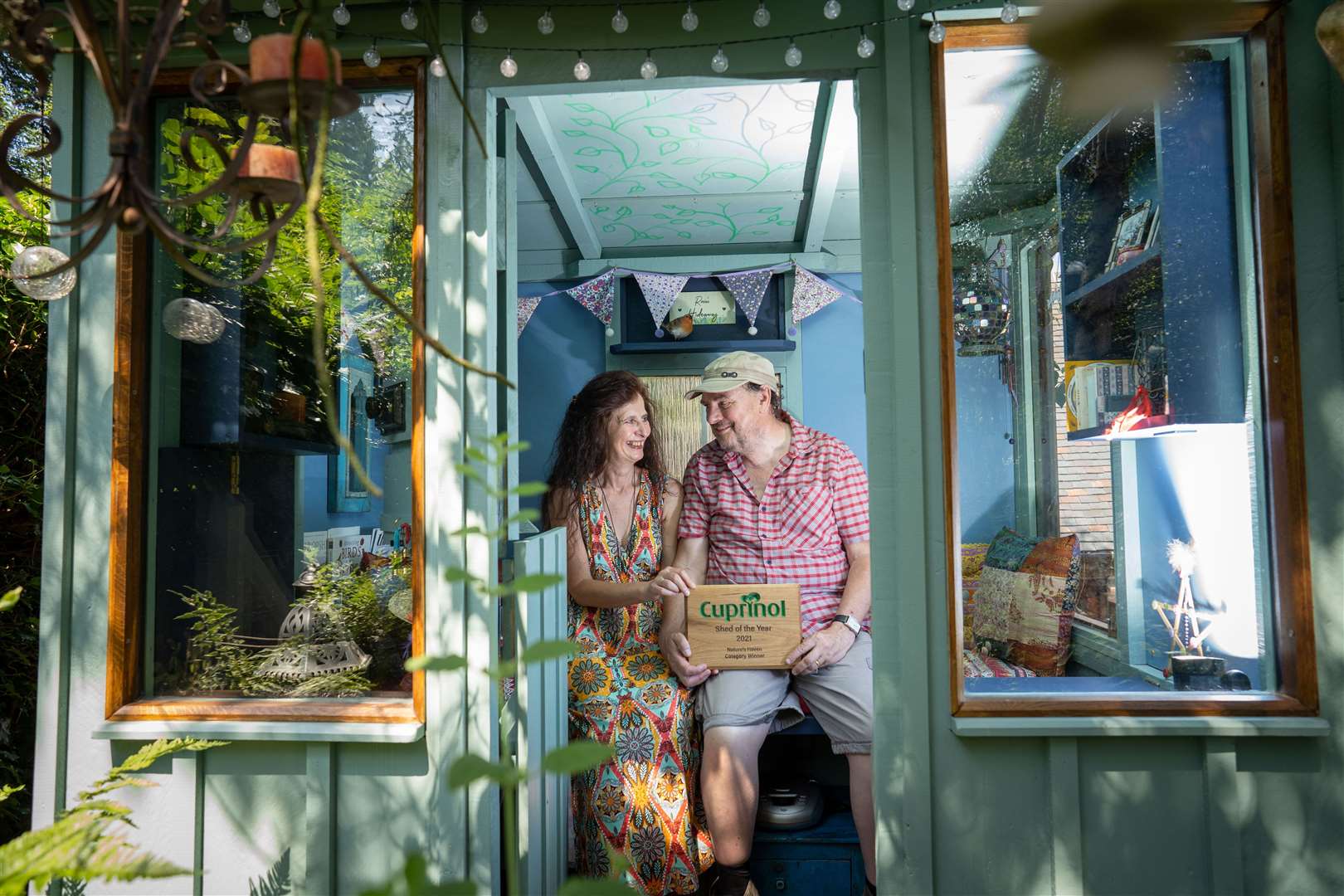 Nature’s haven category winner Rosie Hoult, pictured with her husband David, made a bird-watching sanctuary (Cuprinol Shed of the Year/PA)