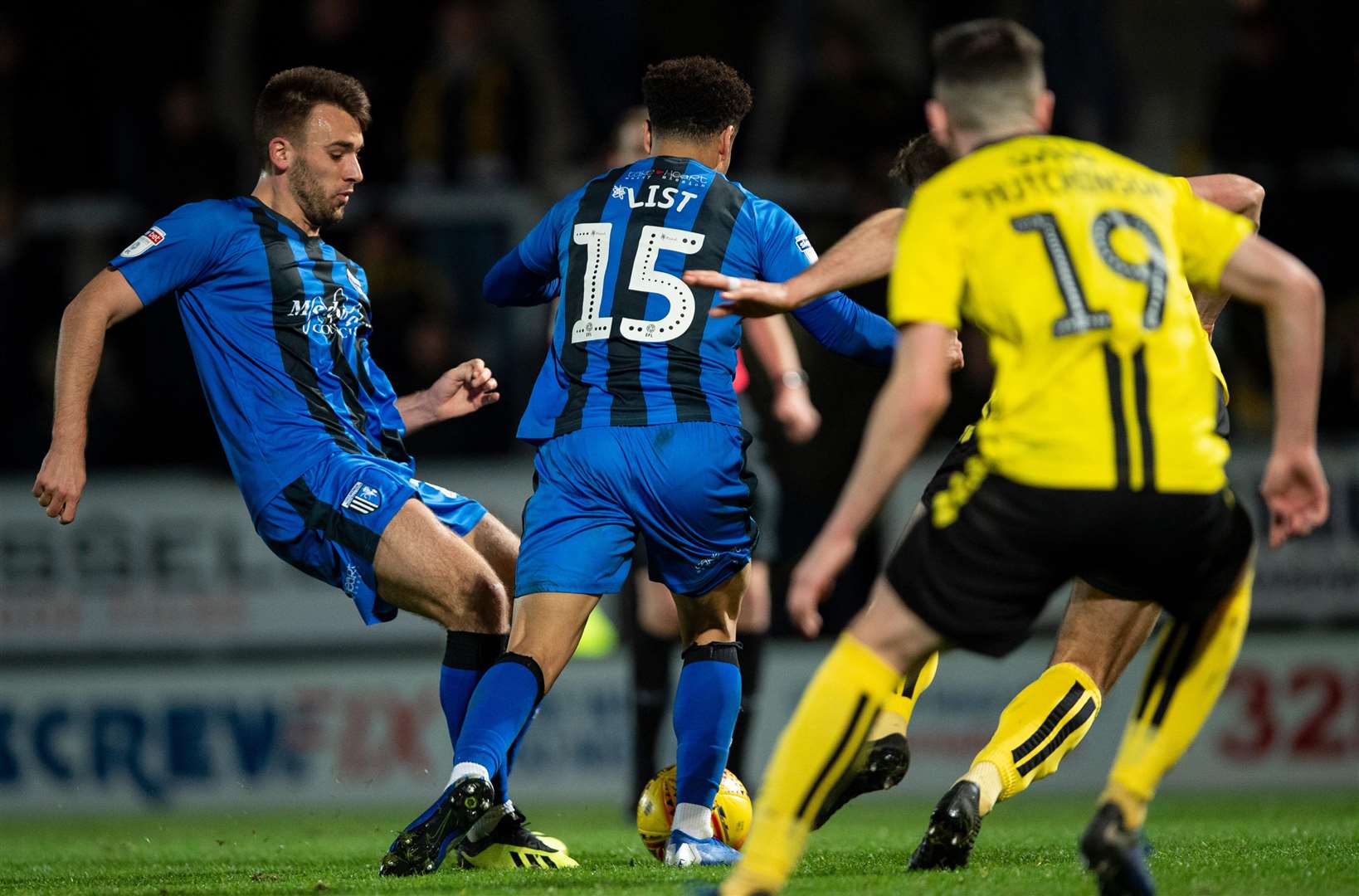 Josh Rees beats Elliott List to the ball to make it 3-2 against Burton Albion Picture: Ady Kerry