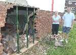 Angie and Steve Davies survey the damage. Picture: BARRY CRAYFORD