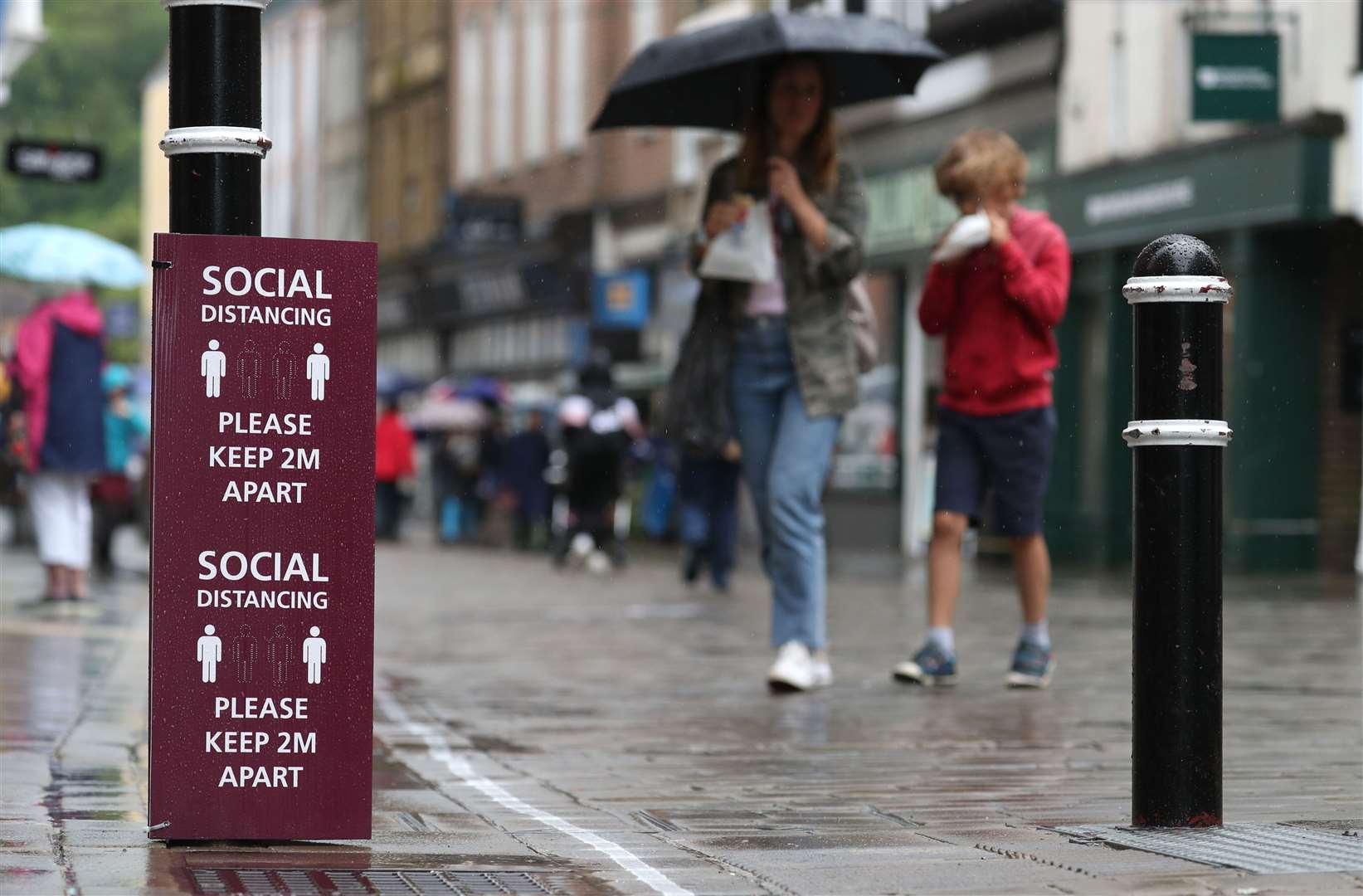 One poll found that the majority of people were in favour of keeping the two metre social distancing rule in place (Andrew Matthews/PA)