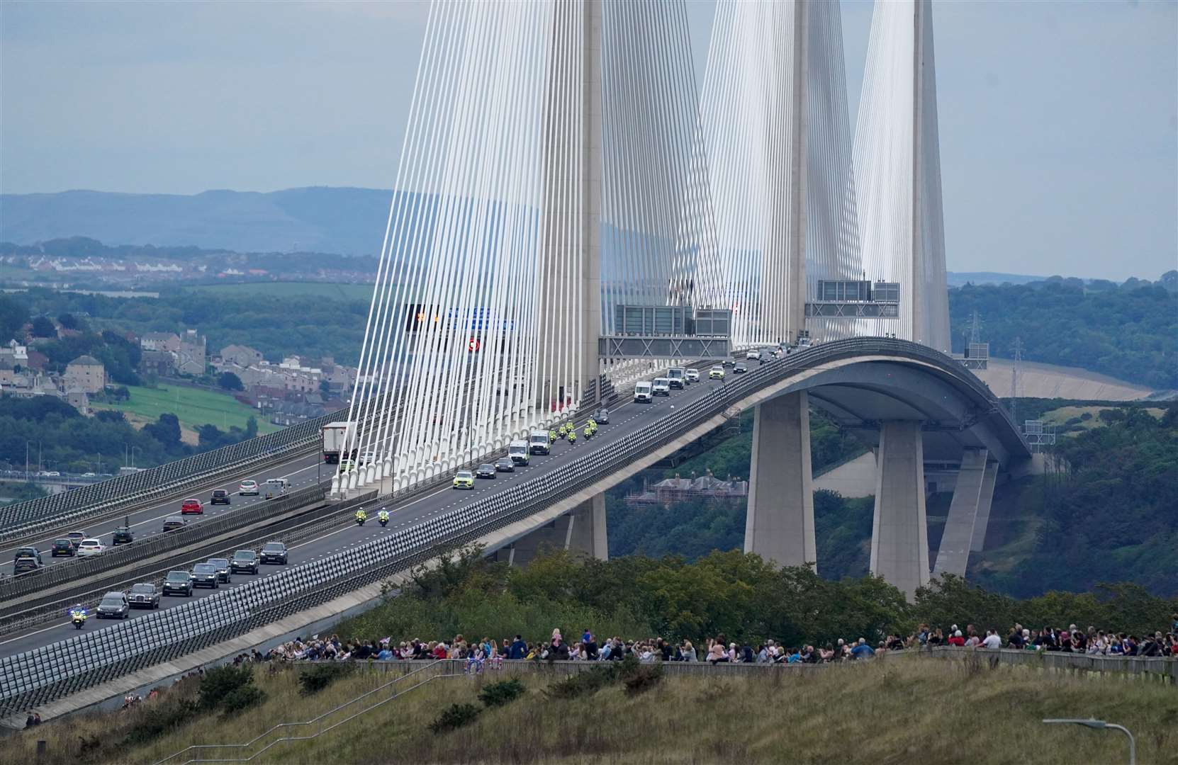 The hearse carrying the coffin of Queen Elizabeth II, draped with the Royal Standard of Scotland, passing over the Queensferry Crossing (Owen Humphreys/PA)