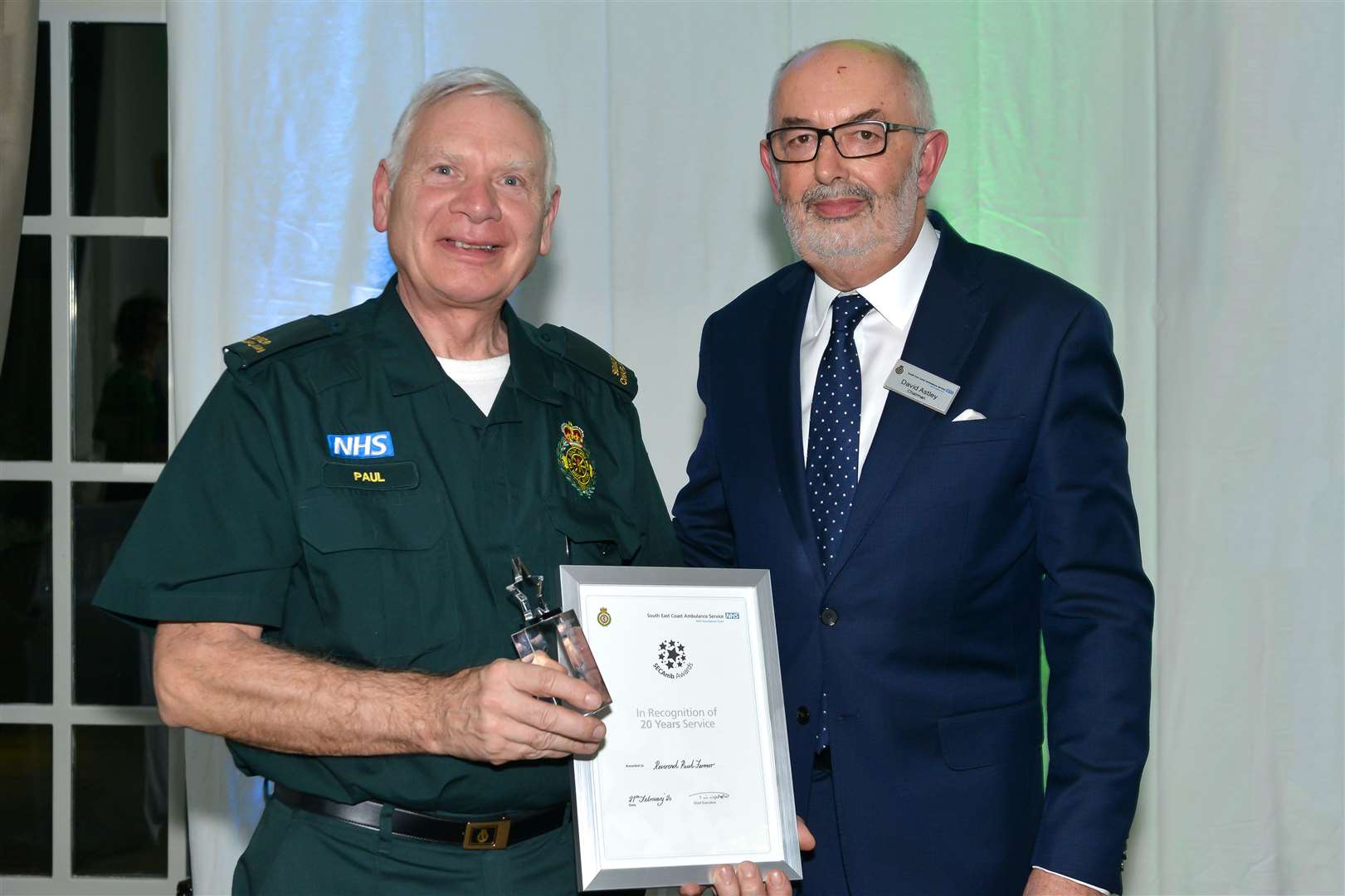 The Rev Paul Fermor receives his award from David Astley OBE, chairman of SECAmb Picture: Cripps Photography