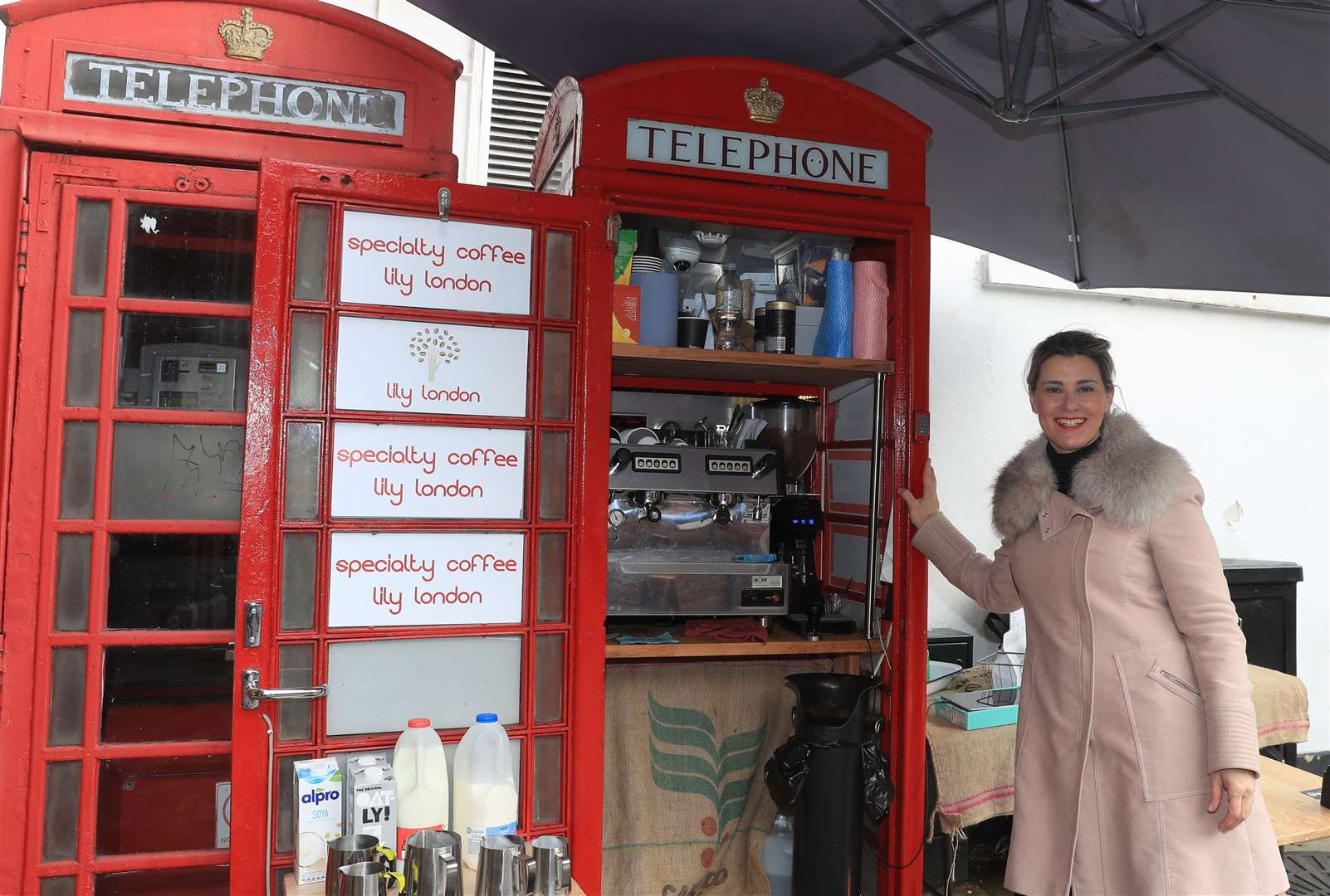 Lily Deluca, from Sao Paolo, has turned a red phone box into a mini coffee kiosk on Tunsgate in Guildford, Surrey (Adam Davy/PA)