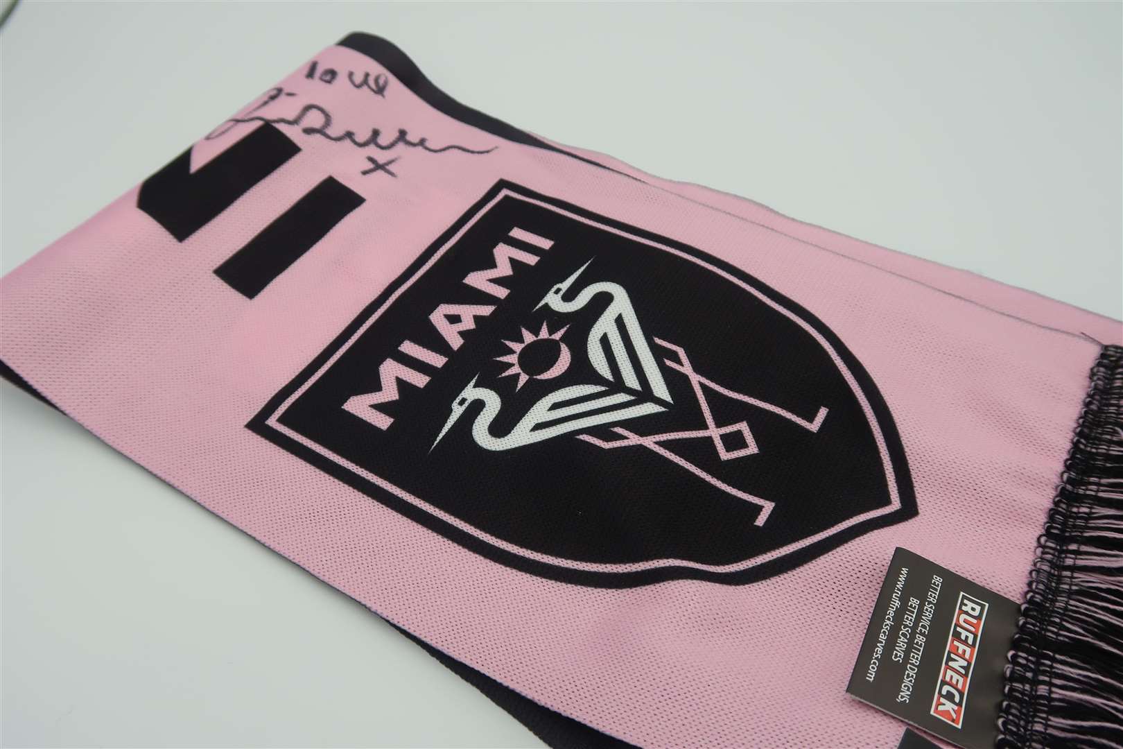 An Inter Miami scarf signed by David Beckham (Cahonas Scotland/PA)