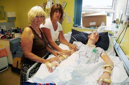 Grandmother Carol Dixon and aunt Jay Barden at Ryan Anderson's hospital bedside.