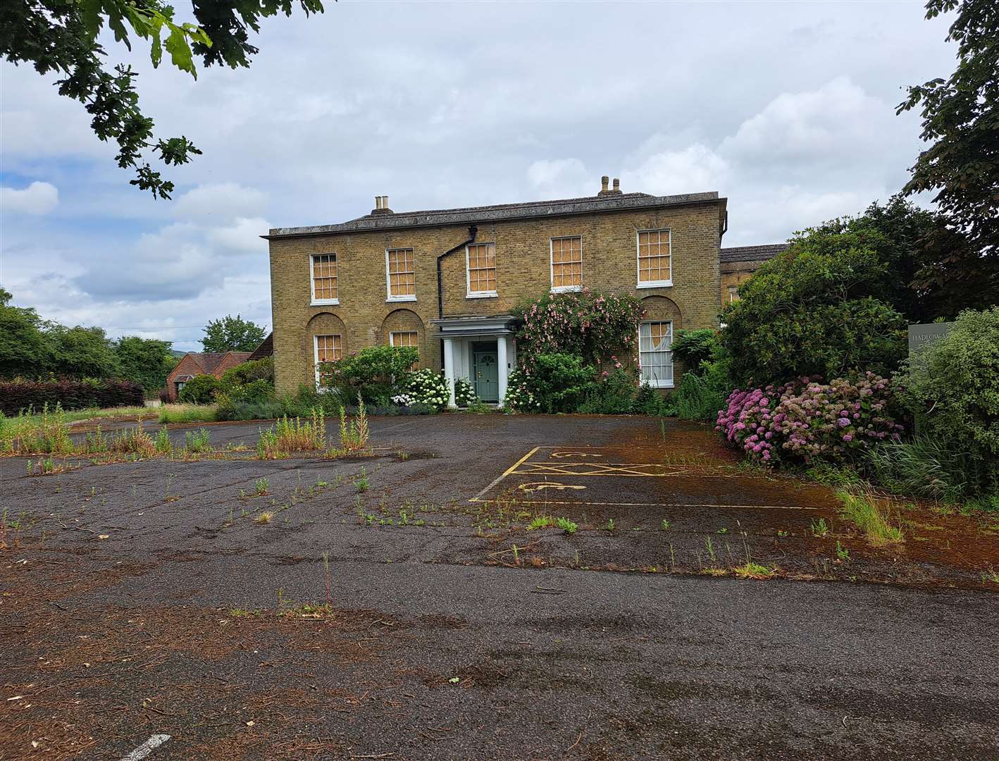 The rather sad-looking Georgian facade of the Hadlow Manor Hotel