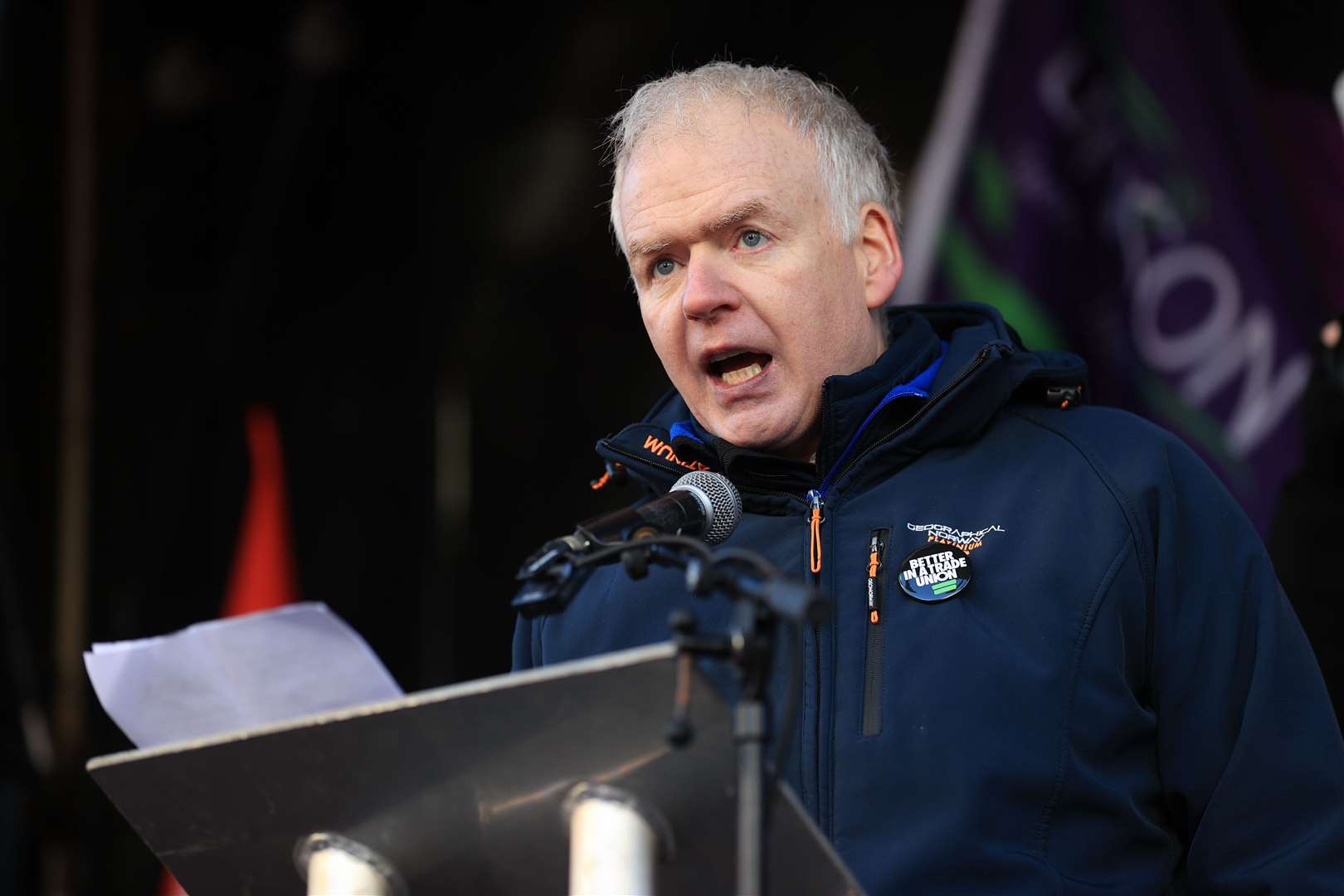 Justin McCamphill, NASUWT national official Northern Ireland, addresses union members at the rally (Liam McBurney/PA)