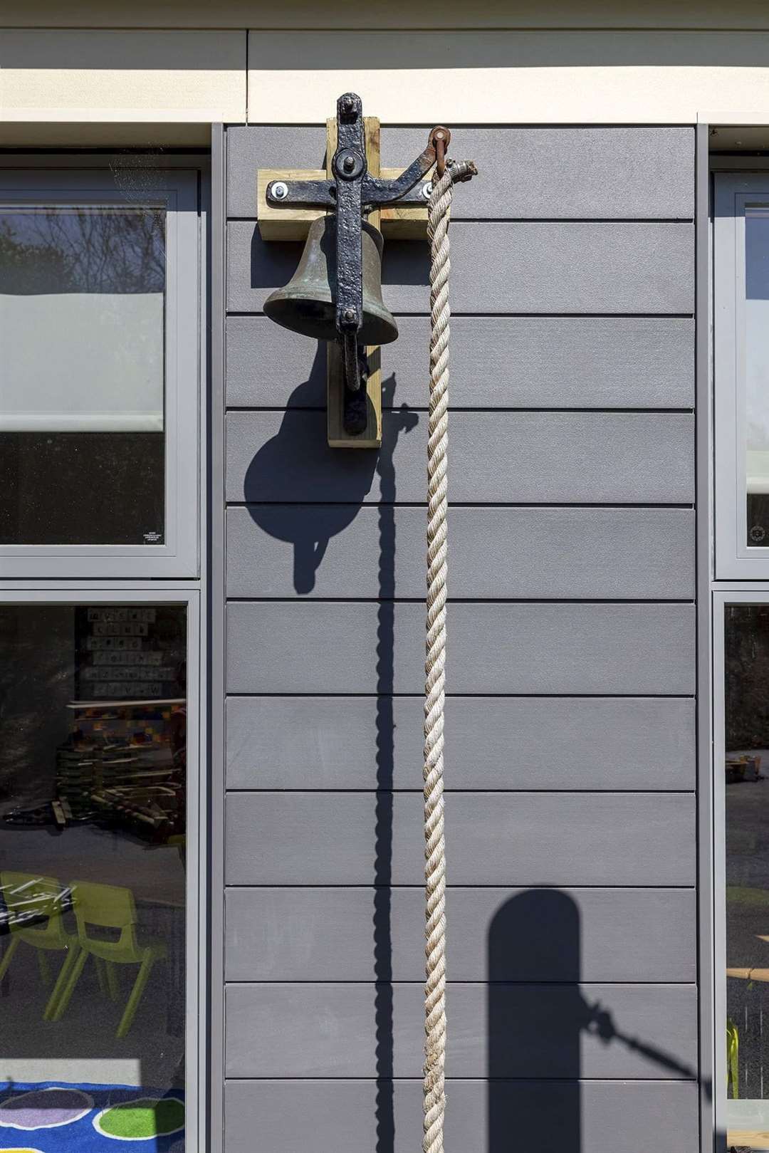 The 176-year-old bell in place at the new school