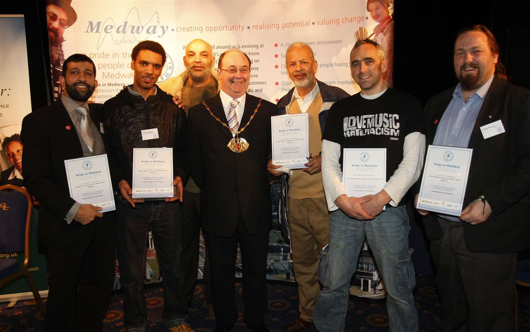 Sucha Singh Gill with members of The Love Music Hate Racism Group at a Pride in Medway awards night