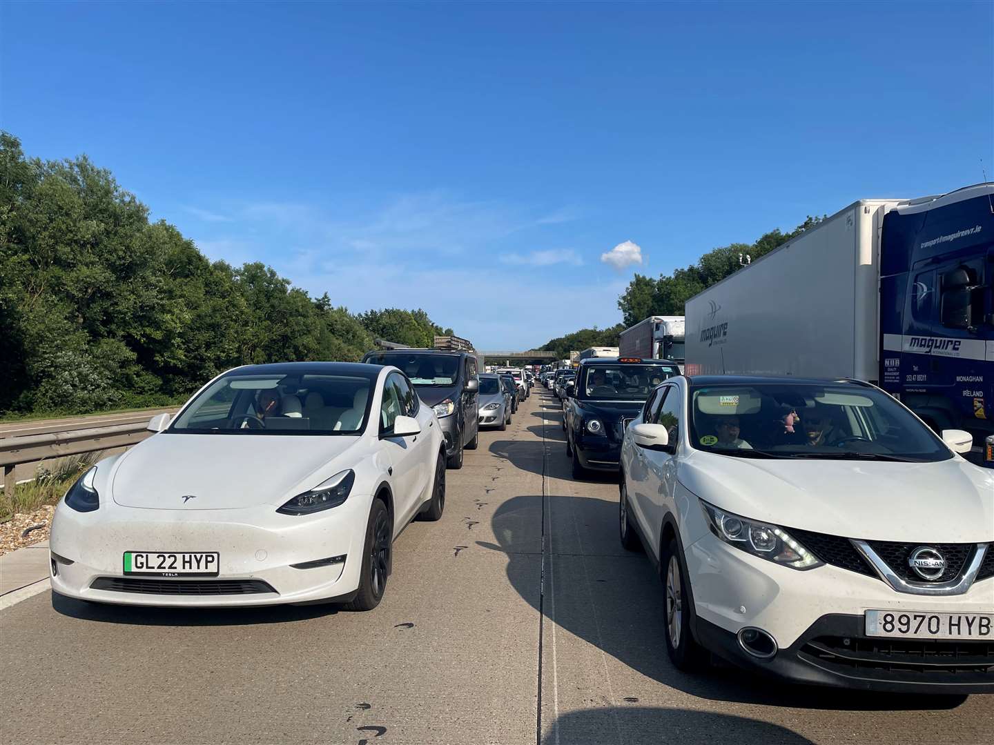 One lane is closed following a crash involving a lorry and a van