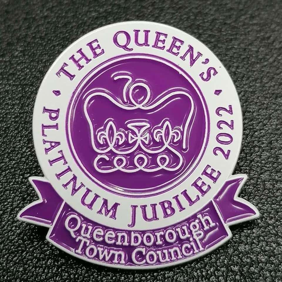 Souvenir Platinum Jubilee pin badges made by local firm Handy Prints for Queenborough Town Council on sale for £2