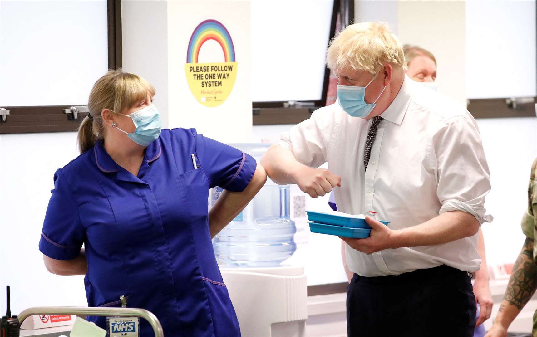 Prime Minister Boris Johnson greets a member of staff during a visit to a vaccination centre in in Moulton Park, Northampton (Peter Cziborra/Reuters/Pool/PA)